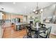 Open concept floor plan featuring a kitchen, breakfast table, and fireplace at 3411 Springbriar Dr, Castle Rock, CO 80109