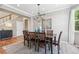 Dining room with hardwood floors, neutral paint, stylish furniture, modern chandelier, and natural light at 3411 Springbriar Dr, Castle Rock, CO 80109
