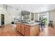Open kitchen featuring granite countertops, stainless steel appliances, and hardwood floors that seamlessly transition to the living area at 3411 Springbriar Dr, Castle Rock, CO 80109