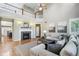 Spacious living room with high ceilings, a fireplace, and large windows at 3411 Springbriar Dr, Castle Rock, CO 80109