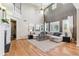 Spacious living room with high ceilings, a fireplace, and large windows at 3411 Springbriar Dr, Castle Rock, CO 80109