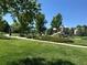 Community playground with modern equipment, walking paths, and green space for outdoor activities at 3411 Springbriar Dr, Castle Rock, CO 80109
