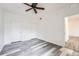 Spacious bedroom with wood-look floors and double closets at 16312 E Fremont Ave # 2, Aurora, CO 80016