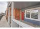 Brick townhouse exterior with a private entrance and small porch at 16312 E Fremont Ave # 2, Aurora, CO 80016