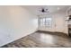 Bright living room with wood-look floors and access to a balcony at 16312 E Fremont Ave # 2, Aurora, CO 80016