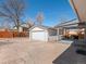 Backyard with a detached garage and covered patio area at 10415 Owens Cir, Broomfield, CO 80021