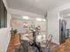 Stylish dining area with a seamless transition to the living room and an open kitchen view at 10415 Owens Cir, Broomfield, CO 80021