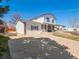 Attractive home showcasing a lengthy driveway, tidy lawn and welcoming front porch at 10415 Owens Cir, Broomfield, CO 80021