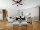 Open living room featuring hardwood floors, comfortable seating, and neutral paint at 10415 Owens Cir, Broomfield, CO 80021