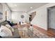 Cozy living room with an open layout, showcasing hardwood floors and neutral décor at 10415 Owens Cir, Broomfield, CO 80021