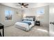 Bright primary bedroom with soft carpet, ceiling fan, neutral paint, and natural light at 10415 Owens Cir, Broomfield, CO 80021