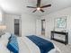 Comfortable bedroom with a ceiling fan, natural light, neutral paint, and soft carpet at 10415 Owens Cir, Broomfield, CO 80021