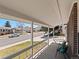 Cozy front porch view with seating, offering a glimpse of the neighborhood street at 10415 Owens Cir, Broomfield, CO 80021