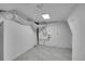 Unfinished basement includes pipes and ducting at 4940 Adams St, Denver, CO 80216