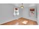 Bright bedroom featuring wood floors and vintage chandelier at 4940 Adams St, Denver, CO 80216