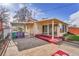 Back of home featuring a covered patio, carport, and sliding glass doors for indoor outdoor living at 4940 Adams St, Denver, CO 80216