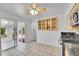 Functional kitchen featuring stainless steel appliances, tile floors and a seamless flow to the sunroom at 4940 Adams St, Denver, CO 80216