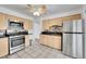 Updated kitchen featuring stainless steel appliances, granite countertops, and updated fixtures at 4940 Adams St, Denver, CO 80216