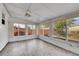 Bright sunroom with many windows overlooking the backyard, providing a peaceful retreat at 4940 Adams St, Denver, CO 80216