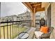Cozy balcony featuring outdoor seating with a view of the community landscaping at 11250 Florence St # 21A, Commerce City, CO 80640