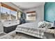 Comfortable bedroom featuring a double bed, large windows and closet rack at 11250 Florence St # 21A, Commerce City, CO 80640