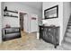 Stylish entryway with modern decor, including a decorative cabinet and mirror at 11250 Florence St # 21A, Commerce City, CO 80640