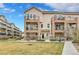 Attractive three-story townhome with private balconies and charming stone accents on the exterior at 11250 Florence St # 21A, Commerce City, CO 80640