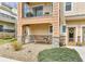 Inviting front porch with stone accents and seating area, leading to the entrance at 11250 Florence St # 21A, Commerce City, CO 80640