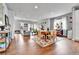 Spacious living area with hardwood floors, ample natural light, and stylish furnishings at 11250 Florence St # 21A, Commerce City, CO 80640