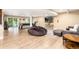 Spacious finished basement perfect for entertainment, featuring a pool table, tv, and comfortable seating at 2480 W Jamison Way, Littleton, CO 80120