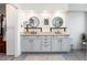 Bright bathroom with double vanity, modern mirrors and fixtures, and ample storage at 2480 W Jamison Way, Littleton, CO 80120