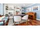 Bright home office with custom built-in shelving, blue walls, and hardwood floors at 2480 W Jamison Way, Littleton, CO 80120