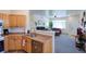 Bright kitchen area with stainless steel appliances and an open view into the living room area at 13708 Legend Trl # 101, Broomfield, CO 80023