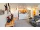 Open-concept living room showing the neutral interior design and connection to the kitchen at 13708 Legend Trl # 101, Broomfield, CO 80023