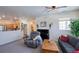 View of living room featuring a piano and comfortable seating area with lots of light at 13708 Legend Trl # 101, Broomfield, CO 80023