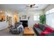 Bright living room featuring comfortable seating, large window, and neutral walls at 13708 Legend Trl # 101, Broomfield, CO 80023