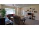 Comfortable living room with a view of the entry door and plenty of natural light at 13708 Legend Trl # 101, Broomfield, CO 80023