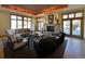 Relaxing lounge area with comfortable seating, a cozy fireplace, and large windows offering plenty of natural light at 13708 Legend Trl # 101, Broomfield, CO 80023