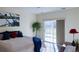 Bright main bedroom featuring a sliding glass door and a comfortable bed at 13708 Legend Trl # 101, Broomfield, CO 80023