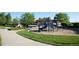Bright playground with climbing structures, swings, and a picnic area, perfect for community fun at 13708 Legend Trl # 101, Broomfield, CO 80023