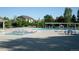 Outdoor community pool with plenty of lounge chairs and picnic tables to relax and enjoy the water and sunshine at 13708 Legend Trl # 101, Broomfield, CO 80023