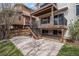 Backyard with stairs leading up to a deck, concrete pad and a privacy fence at 9195 Anasazi Indian Trl, Highlands Ranch, CO 80129