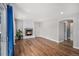 Spacious living area featuring a fireplace, wood floors, and lots of natural light at 9195 Anasazi Indian Trl, Highlands Ranch, CO 80129
