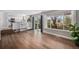 Open-concept living space with hardwood floors and seamless flow to the kitchen at 9195 Anasazi Indian Trl, Highlands Ranch, CO 80129