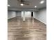 Finished basement with wood-look flooring, recessed lighting and gray painted walls at 1137 S Coolidge Cir, Aurora, CO 80018