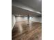 Spacious basement featuring wood-look flooring, neutral paint, recessed lighting and a ceiling fan at 1137 S Coolidge Cir, Aurora, CO 80018