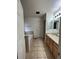 Neutral bathroom features a soaking tub and a vanity with a sink and mirror at 1137 S Coolidge Cir, Aurora, CO 80018