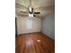 Bright bedroom featuring sleek ceiling fan, light grey walls, and wood-look laminate flooring at 1137 S Coolidge Cir, Aurora, CO 80018