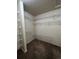 Walk-in closet featuring brown carpeting and white wire shelving on all sides at 1137 S Coolidge Cir, Aurora, CO 80018