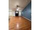 Spacious living room featuring vaulted ceilings, laminate flooring, ceiling fan, and fireplace at 1137 S Coolidge Cir, Aurora, CO 80018